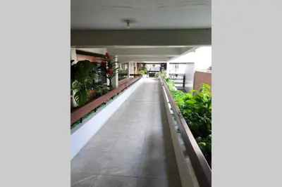 an empty hallway in a building with plants at (5)Modern Miraflores tourist area apartment in Lima