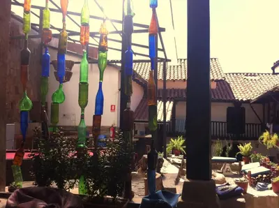 a group of glass umbrellas hanging from a building at Intro Hostels Cusco in Cusco