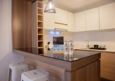 a kitchen with a counter with two water bottles at Martinto 114 by Wynwood House in Lima