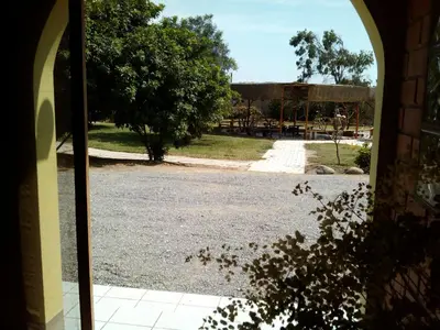 an open door with a view of a park at Huaranjapo in El Carmen