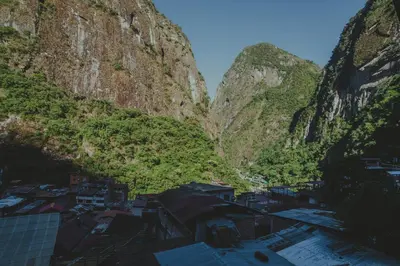 a view of a city between two mountains at Rupa Rupa High Jungle Eco B&B in Machu Picchu