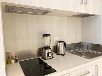 a kitchen with a blender on a counter next to a sink at Primera Parada By Wynwood House in Lima