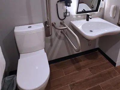 a bathroom with a toilet and a sink at ibis styles Lima San Isidro in Lima