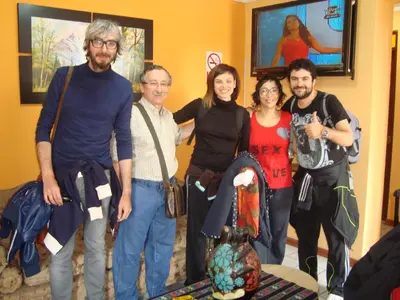 a group of people posing for a picture at Kurmi Hostel Lima Airport in Lima