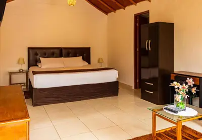 a bedroom with a large bed in a room at Qala Hotels & Resorts in Chincha Alta