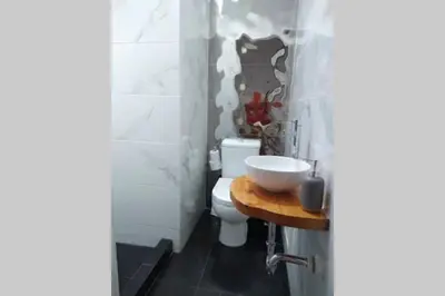 a bathroom with a sink and a toilet at Barranc Group Penthouse in Lima