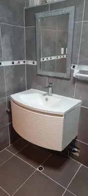 a bathroom with a sink and a mirror at Apart Hotel Don Ernesto in Lima