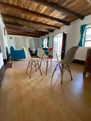 a room with four chairs and a table in it at CASA ANDINA PRIVADA a lado del Museo - Qespiwanka in Urubamba