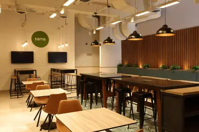a restaurant with tables and chairs in a room at Casa Andina Standard Benavides in Lima