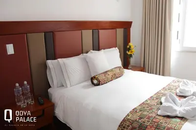 a hotel room with a bed with a pillow on it at Hotel Qoya Palace - Machupicchu in Machu Picchu