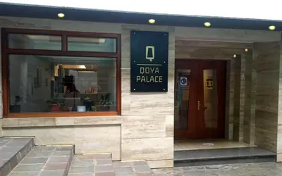 a building with a sign that reads oxka palace at Hotel Qoya Palace - Machupicchu in Machu Picchu