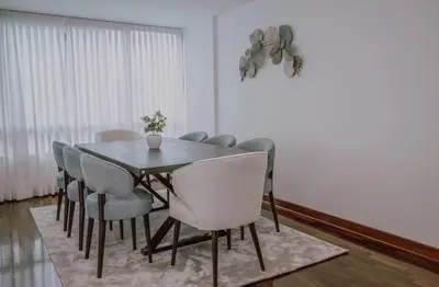 a dining room with a table and chairs at Departamento Premium De Estreno En Miraflores in Lima