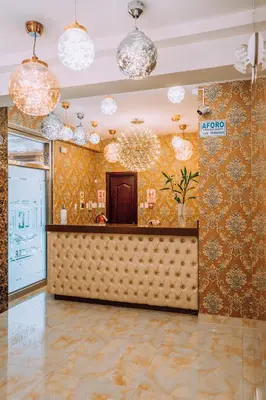 a restaurant with a bar in a room with wallpaper at Lima Central Design Hotel Spa & Club in Lima
