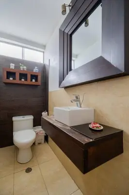 a bathroom with a sink and a toilet at Balconcito Peruano & AMPLIO 2 dormitorios in Lima