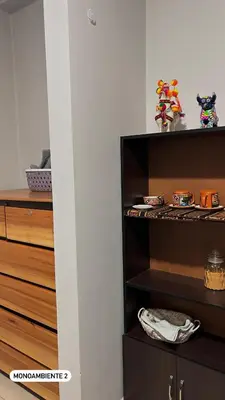 a room with a closet with wooden shelves at El Viejo Roble in Cusco