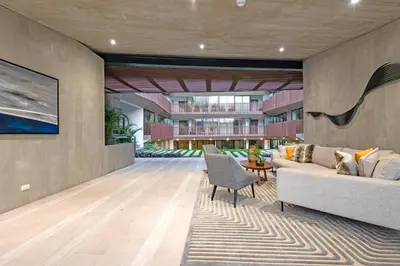 a living room with a couch and a table at ✶ Nazca Penthouse ✶ 3-stories LUXURY Rooftop Pool in Lima