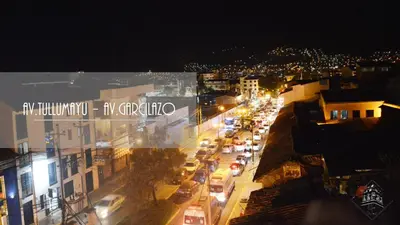 a city street at night with cars on the road at Elsa Wasi Cusco in Cusco