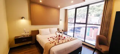 a hotel room with a bed with hearts on it at Hotel Raices Machupicchu in Machu Picchu