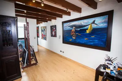 a room with a large painting on the wall at Beautiful Penthouse in Lima, in front of the park in Lima