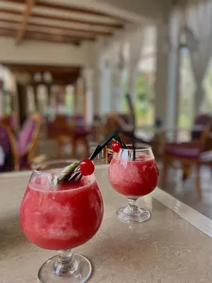 two cocktails sitting on top of a table at Hosteria Suiza in Ica