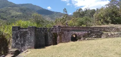 a person standing on top of a brick wall at La Casita de Oxapampa in Oxapampa