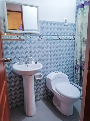 a bathroom with a toilet and a sink at Full apartment independent entrance, services included in Lima