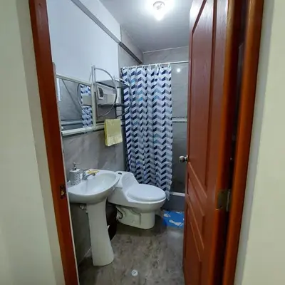 a small bathroom with a toilet and a sink at Full apartment independent entrance, services included in Lima