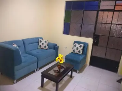 a living room with a blue couch and two chairs at 101 Comfy Apt WiFi kitchen SmartTV Central at Callao in Lima