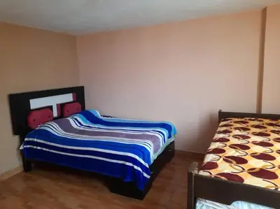 a bedroom with two beds in a room at 402 Comfy Apt WiFi kitchen SmartTV Central at Callao in Lima