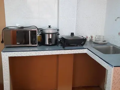 a kitchen counter with a toaster and a microwave on it at 402 Comfy Apt WiFi kitchen SmartTV Central at Callao in Lima