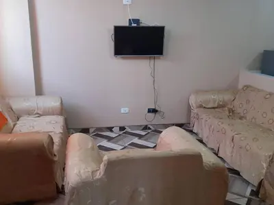 a living room with couches and a flat screen tv at 301 Comfy Apt WiFi kitchen SmartTV Central at Callao in Lima