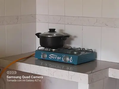 a pot on top of a stove in a kitchen at 301 Comfy Apt WiFi kitchen SmartTV Central at Callao in Lima
