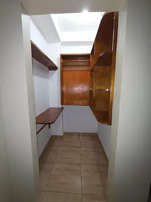 a small hallway with a bench and a skylight at HOTEL MAR Y LAGO in Lunahuaná