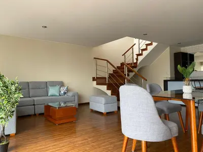 a living room with a couch and a table at Miraflores - Luxury Room in the Best Place in Lima