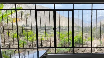 a window with a view of a mountain view at Las Cabañas de Incahuasi in Lunahuaná