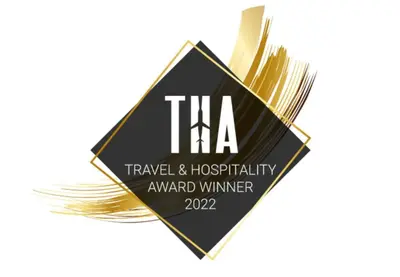 a black and gold sign with the words tka at La Ruta in Paracas