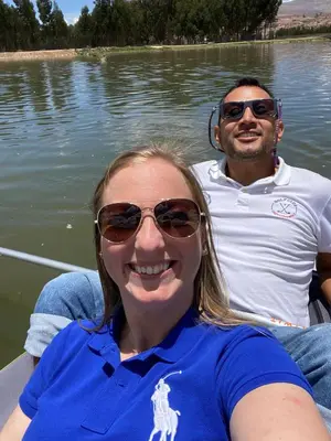 a man and a woman in a boat on the water at CasaHotel Laguna Jauja Airport in Jauja