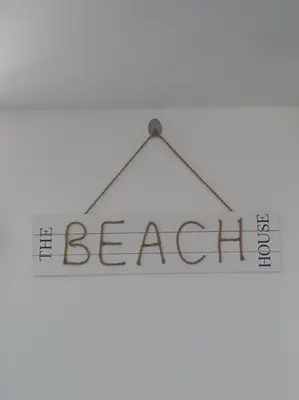 a sign with the word benefit hanging on a peg at Depa de Playa en Asia in Asia