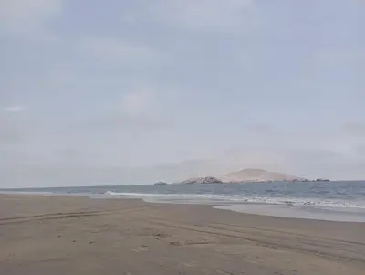 an empty beach with the ocean in the background at Depa de Playa en Asia in Asia