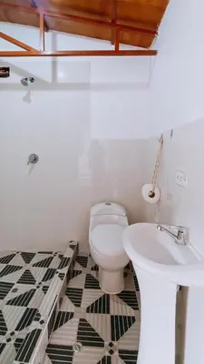 a bathroom with a toilet and a sink at The Willow B&B in Urubamba