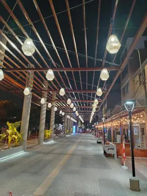 a building with lights hanging from the ceiling at Chakana Family Home 2 Lima Airport in Lima
