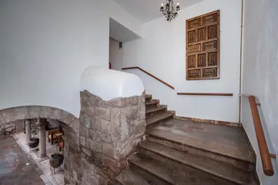 a room with a stone staircase with snow on top at Estancia San Pedro Hotel in Cusco