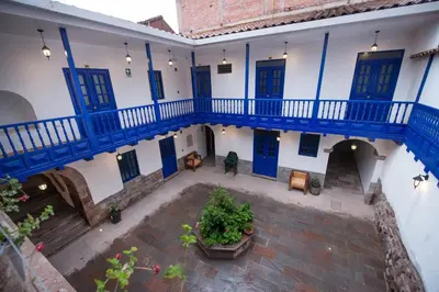 an overhead view of a building with blue doors and a courtyard at Estancia San Pedro Hotel in Cusco
