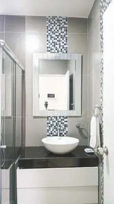 a bathroom with a sink and a mirror at Apartamento JATUN MAMA in Chancay