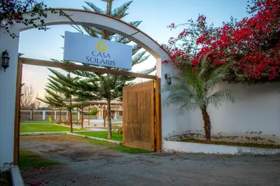 a door to a sign that reads cay savarius at Casa Solaris in Ica