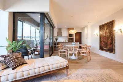 a living room with a couch and a table at ✶ Maras Residence ✶ LUXURY Rooftop Pool & Grill in Lima