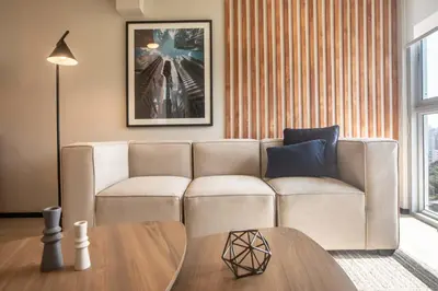 a living room with a couch and a table at Pionero by Wynwood House in Lima