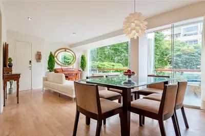 a dining room with a glass table and chairs at ✶ Kotosh Residence ✶ LUXURY Best Location & Piano in Lima