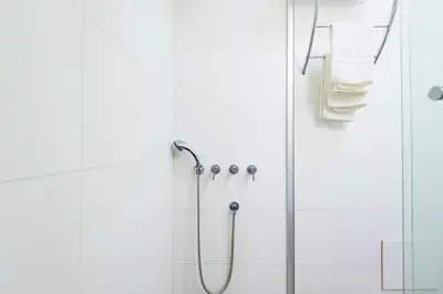 a shower in a bathroom with a glass door at ✶ Kotosh Residence ✶ LUXURY Best Location & Piano in Lima