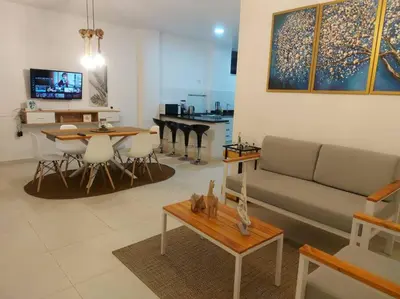 a living room with a couch and a table at Playa ChinchaHouse - Agradable casa de playa en Chinchaycamac in Chincha Baja